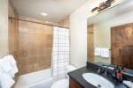A full bathroom with tub/shower combination serves the top floor bedrooms.